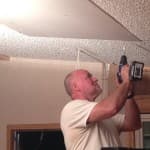 My dad covering up the hole in the ceiling