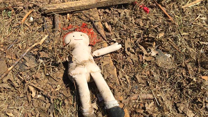 image of a doll left behind in the canton texas tornado aftermath